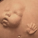 Illustration for article titled This Special Effects Artist Did Something Totally Amazing With Her Pregnant Stomach